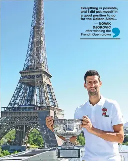  ?? — AFP ?? Novak Djokovic poses with the 2021 French Open trophy in front of the Eiffel tower in Paris on Monday.