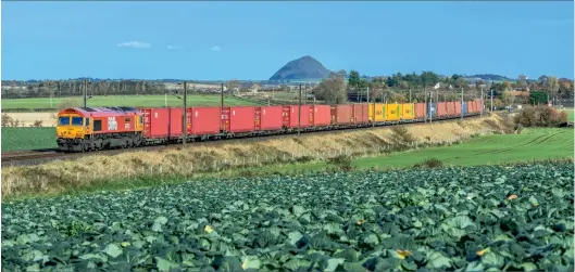  ??  ?? GBRf Class 66/7 66783 The Flying Dustman heads the inaugural 4S69 0608 Doncaster Iport to Elderslie intermodal on November 3, 2020. The train passes through the East Lothian countrysid­e at Spittal, with the iconic Bass rock in the background. (Graham Scott)