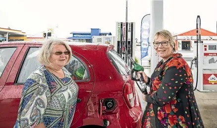  ?? BRADEN FASTIER/STUFF ?? Minister for Seniors Tracey Martin, right, fills SuperGold Card holder Diane Morgan’s car with fuel at NPD Richmond during her visit to Nelson to promote the SuperGold app and upgraded website.