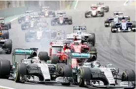  ??  ?? SAO PAULO: Mercedes driver Nico Rosberg, of Germany, leads the race followed by teammate Lewis Hamilton, of Britain, after the start of the Formula One Brazilian Grand Prix at the Interlagos race track in Sao Paulo, Brazil, yesterday. — AP