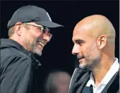  ?? GETTY IMAGES ?? The hugs, the smiles... when the game is done, Klopp and Guardiola call each other the greatest.
