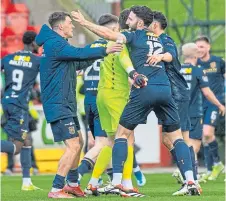  ?? ?? Jubilant Dundee players on bagging the top-six finish.