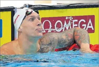  ?? ?? Caleb Dressel escupe un poco de agua al final de una prueba durante los Mundiales de Budapest.