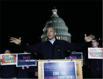  ?? ASSOCIATED PRESS ?? Sen. Cory Booker D-N.J., speaks during a rally in support of the Deferred Action for Childhood Arrivals (DACA), and to avoid a government shutdown on Jan. 19 in Washington.