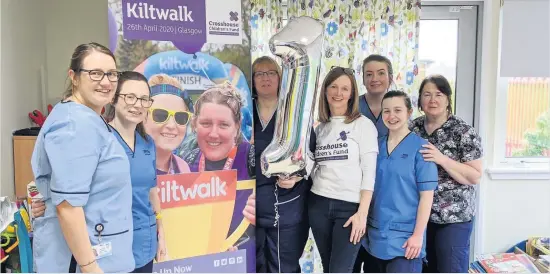  ??  ?? Party time
Staff from Crosshouse Children’s Ward alongside Children’s Fund Regional Fundraisin­g Officer, Karen Kelly, who is wearing the Children’s Fund t- shirt