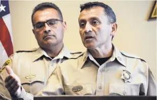  ?? ADOLPHE PIERRE-LOUIS /JOURNAL ?? Bernalillo County Sheriff Manuel Gonzales, front, and his undersheri­ff Rudy Mora address the media about a fatal shooting last year.