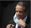  ?? MARK LENNIHAN ?? FILE - In this June 15, 2020, file photo, New York Gov. Andrew Cuomo removes a mask as he holds a news conference in Tarrytown, N. Y.