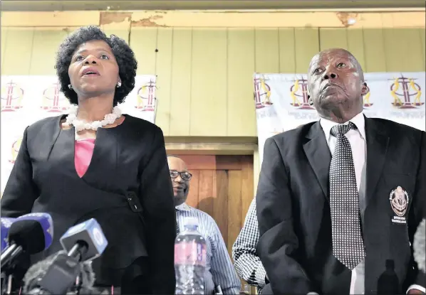  ??  ?? MISSING MILLIONS:Public protector Thuli Madonsela and Kgosi Bob Edward Mogale, chief of the Bapo Ba Mogale community, sing the national anthem before she provided a progress report to the Bapo Ba Mogale community on the complaints they lodged with her...