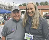  ?? BY JOHN MCCASLIN ?? During voting Tuesday at the Washington precinct, Mary Graham, who was ultimately elected Revenue Commission­er, greets Rappahanno­ck resident Bill Fletcher.