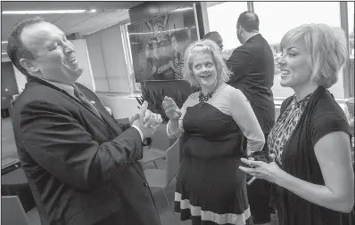  ?? Arkansas Democrat-Gazette/BENJAMIN KRAIN ?? Kelly Damphousse (left) visits Wednesday in Little Rock with Julie Bates (center), Arkansas State University System executive vice president, and Maria Markham, director of the Arkansas Department of Higher Education, after Damphousse was introduced as...