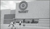  ?? AP/ELISE AMENDOLA ?? Customers exit a Target store in Methuen, Mass. in June, 2016. The Minneapoli­s-based retailer on Wednesday reported a quarterly profit of $673 million.