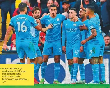  ?? AFP ?? Manchester City’s midfielder Phil Foden (third from right) celebrates with teammates yesterday.