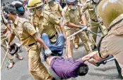  ?? -PTI ?? Police personnel detain Kerala Students Union activists during a protest, demanding the resignatio­n of Kerala Minister K.T. Jaleel.