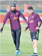  ??  ?? Searching for form: Mason Greenwood (left) at training with Daniel James yesterday