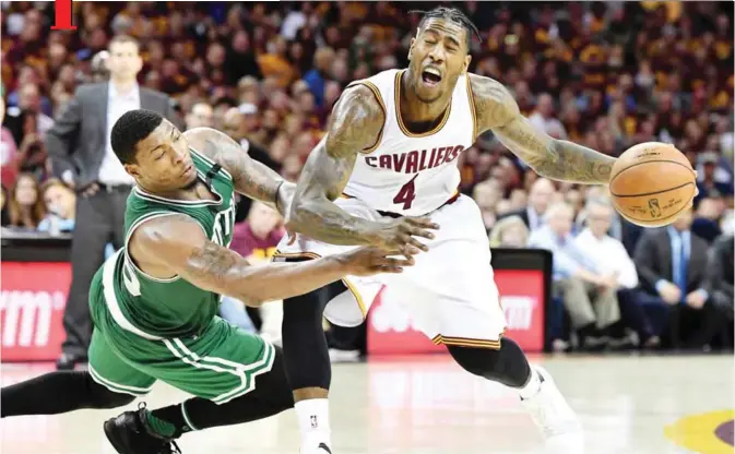  ??  ?? CLEVELAND: Marcus Smart #36 of the Boston Celtics fouls Iman Shumpert #4 of the Cleveland Cavaliers in the second half during Game Three of the 2017 NBA Eastern Conference Finals at Quicken Loans Arena. — AFP