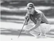  ?? ROB SCHUMACHER USA TODAY Network ?? Collin Morikawa lines up a putt on hole No. 7 during the final round of the Masters Tournament on Sunday.