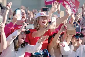  ?? EVAN VUCCI/AP ?? Supporters of President Donald Trump cheerWedne­sday as he walks off the stage after speaking during a campaign rally in Goodyear, Arizona.