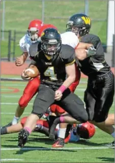  ?? Montgomery Media / SCOTT ROMAN ?? Archbishop Wood’s Andrew Guckin looks for running room in a regular season win over Archbishop Carroll.