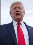  ?? CAROLYN KASTER — AP ?? President Donald Trump speaks to the media as he arrives on Air Force One at Pitt Greenville Airport, in Greenville, N.C., Wednesday.