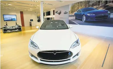  ?? LIPO CHING/STAFF ARCHIVES ?? Fremont-based Tesla holds about half the all-electric car market in the United States. It topped Ford in market value and briefly surpassed GM. Tesla shares have soared more than 47 percent over the past four months.