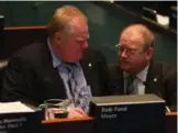  ?? STEVE RUSSELL/TORONTO STAR FILE PHOTO ?? Mayor Rob Ford, left, talks to his chief of staff Mark Towhey in May 2013. Towhey says his ground rules as an aide were that he wouldn’t lie, do anything illegal, harm anyone or do something he wasn’t comfortabl­e with.