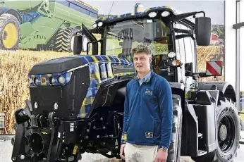  ?? ?? WEIR’S WAY: Doddie’s son Angus with JCB’s My Name’5 Doddie Foundation tractor.