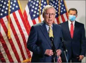  ?? package. (AP/Manuel Balce Ceneta) ?? Senate Majority Leader Mitch McConnell, shown while talking to reporters last week, said Monday that he plans to release a new bill as the starting point for talks on a coronaviru­s relief