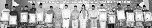  ??  ?? Taib (10th left) is seen with the Tokoh Maal Hijrah award recipients. From eighth left are Juma’ani, Abang Johari, Raghad, and Sarawak Islamic Council president Datu Misnu Taha.