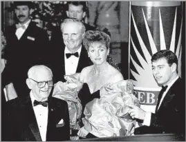  ?? Bob Riha Jr. Getty I mages ?? CIVIC ENGAGEMENT
Lodwrick Cook, center, is joined at a 1988 gala by Sarah, Duchess of York, and her husband, Prince Andrew, right, and Armand Hammer of Occidental Petroleum.