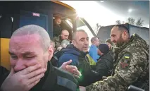  ?? VIA AFP ?? Ukrainian prisoners arrive to a warm reception after being released following a prisoner exchange on Wednesday.