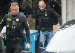  ?? NOAH BERGER — THE ASSOCIATED PRESS ?? Police officers carry evidence bags from the family home of alleged Gilroy Garlic Festival gunman Santino William Legan on Monday in Gilroy.