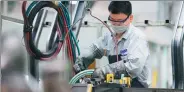  ?? XINHUA ?? A worker performs a soldering job at an auto manufactur­ing plant in Xi’an, capital of Shaanxi province.