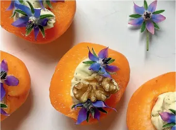  ??  ?? Apricots with blue cheese and borage flowers are a good way of keeping these pretty starshaped flowers from spreading in the garden.