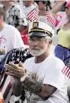  ?? ANDREW ULOZA FOR THE MIAMI HERALD ?? Luis Velasquez at the July 4 celebratio­n in 2011 in Hollywood Beach.