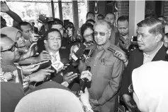  ??  ?? Parti Pribumi Bersatu Malaysia (PPBM) chairman Tun Dr Mahathir Mohamad speaking with reporters on his meeting with Home Ministry secretary-general Datuk Seri Alwi Ibrahim to seek clarificat­ion over the status of the Pakatan Harapan applicatio­n for...