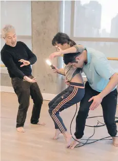  ?? CHRIS RANDLE ?? Kinesis Dance somatheatr­o artistic director and founder Paraskevas Terezakis coaches dancers Renee Sigouin and Arash Khakpour through his creation, In PENUMBRA, exploring the concept of Utopia.