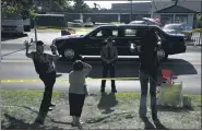  ?? JACQUELINE LARMA — THE ASSOCIATED PRESS ?? Supporters wave at President Donald Trump’s vehicle as it drives in a motorcade.