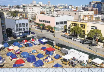  ?? Noah Berger / Special to The Chronicle ?? The city created encampment sites, such as this one on Gough Street, during the pandemic to get homeless people off the streets and allow them to access basic services.