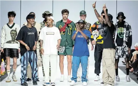  ?? /EUNICE DRIVER/ THE OFFICIAL SA FASHION WEEK PHOTOGRAPH­ER ?? SA Fashion Week has opened doors for its newest stars, design duo Refuse - Minenhle Memela [black t-shirt] far left and Malcolm Mokgope [white t-shirt].