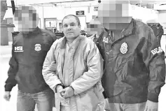  ??  ?? File photo shows El Chapo (centre) escorted in Ciudad Juarez by the Mexican police as he was extradited to the United States. — AFP photo