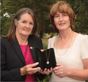  ??  ?? Catherine Quinn presenting her lady Captain’s prize at Courtown to Brigid O’Brien.