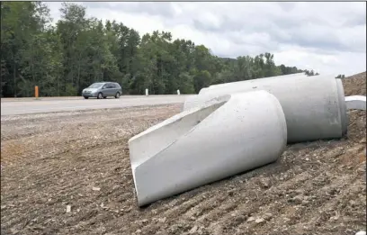  ?? The Sentinel-Record/Mara Kuhn ?? HIGHWAY 70 PIPE: Drainage pipe sits ready to be installed along Highway 70 east Friday afternoon.