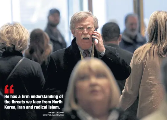  ??  ?? Former US ambassador to the United Nations John Bolton speaks on a mobile phone as he arrives for a meeting with then US President-elect Donald Trump at Trump Tower in New York in December last year.