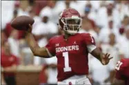  ?? SUE OGROCKI - THE ASSOCIATED PRESS ?? In this Saturday, Sept. 8, 2018, file photo, Oklahoma quarterbac­k Kyler Murray (1) throws during an NCAA college football game against UCLA, in Norman, Okla. Murray was named a Heisman Trophy finalist on Monday, Dec. 3, 2018.