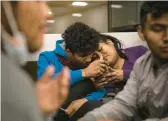  ?? ANA RAMIREZ/THE SAN DIEGO UNION-TRIBUNE 2022 ?? People from Peru and Ecuador seeking asylum in the U.S. wait in an airport in California after being left there by federal officials.