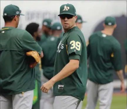  ?? FRANK FRANKLIN II - THE ASSOCIATED PRESS ?? Oakland Athletics relief pitcher Blake Treinen (39) warms up with teammates during a baseball team workout in New York, Tuesday, Oct. 2, 2018. The Athletics play the New York Yankees in an American League wildcard baseball game on Wednesday.