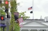  ?? SUSAN WALSH/AP ?? The American flag flies at half-staff over the White House in Washington on Friday after a shooting in Indianapol­is left eight people dead.