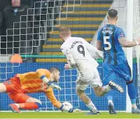  ??  ?? OLI DAY Oli Mcburnie of Swansea slots the ball home