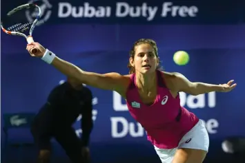  ?? AGENCE FRANCE PRESSE ?? German tennis player Julia Goerges returns the ball to Svetlana Kuznetsova of Russia during their WTA game on the first day of the Dubai Duty Free Tennis Championsh­ips.