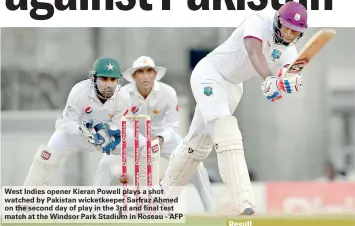  ??  ?? West Indies opener Kieran Powell plays a shot watched by Pakistan wicketkeep­er Sarfraz Ahmed on the second day of play in the 3rd and final test match at the Windsor Park Stadium in Roseau - AFP